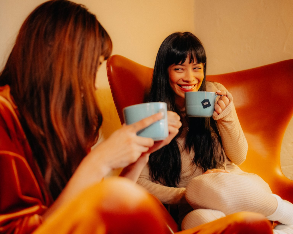 Two ladies drinking shroom tea. 