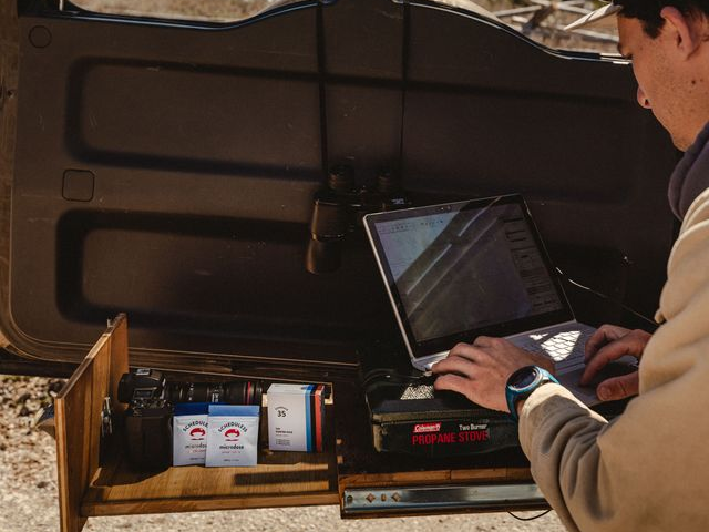 Man ordering shrooms online from laptop.