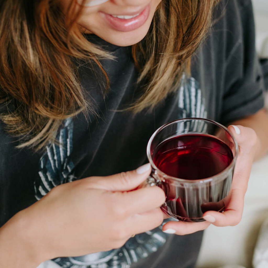 Lady taking shroom tea for microdosing