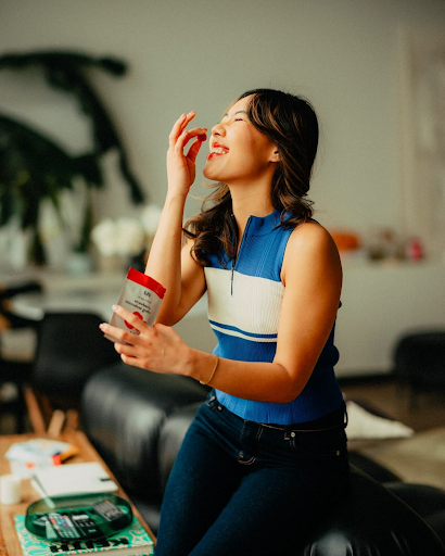 Lady consuming S35 Strawberry Shroom-infused gummy